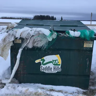 Image of Waste Bin Filled To Overflowing with Farm Waste