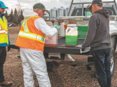 Image of Proper Disposal of Pesticides off back of pickup truck